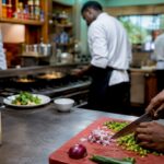 Chefs working at distinct kitchen stations
