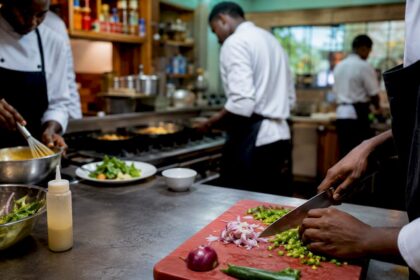 Chefs working at distinct kitchen stations