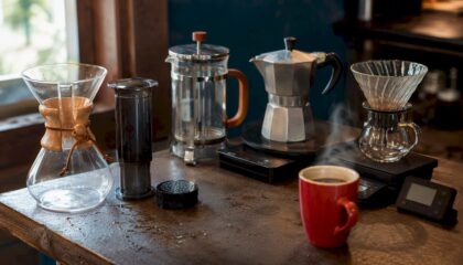 Various home coffee brewing devices on kitchen counter